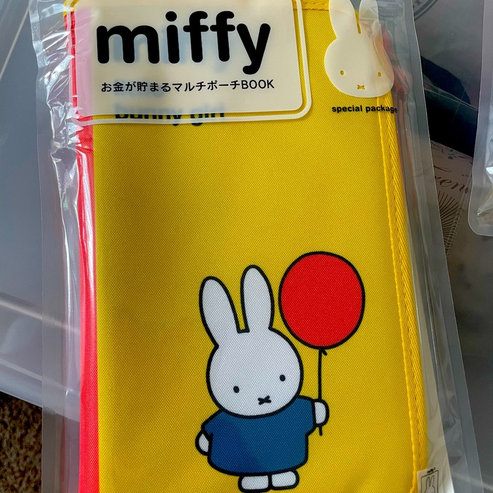 Miffy book , comes with 4 zipper closure plastic sheets in binder book.